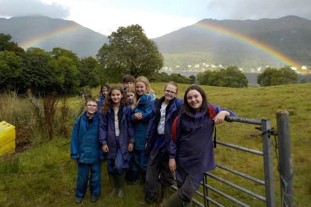 Markinch Primary School pupils explore the great outdoors and take time out for a photo shoot - just as a rainbow frames the shot. Perfect timing!