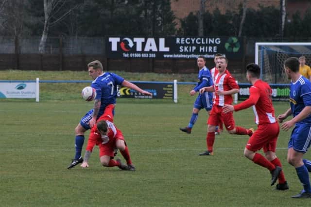 The battling midfields go toe to toe. Pic by Graham Strachan.