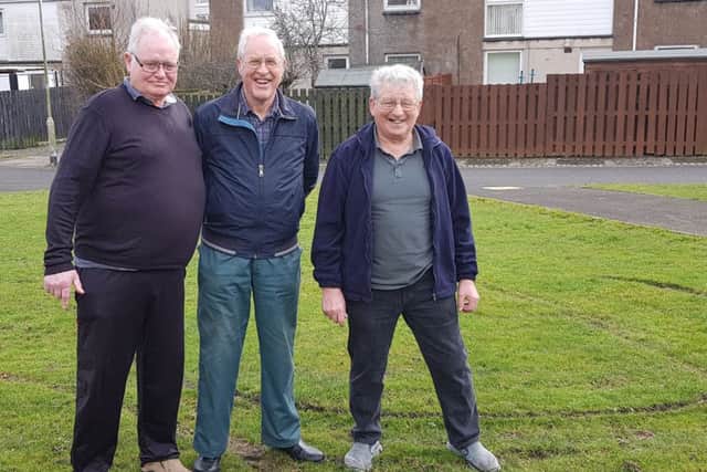 From left: James Arnott, John Smith and George Lothian on the grassy area next to Chapel Road in Kirkcaldy