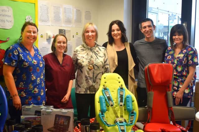 Charlene with her work colleagues and family at Victoria Hospital, Kirkcaldy with the adapted seating for the childrens' ward. Pic: NHS Fife.