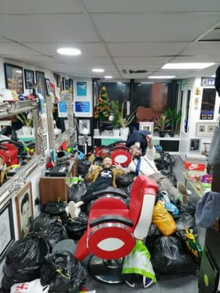 Jamie (left) and Mark with the clothes they collected for the homelss