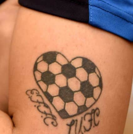 Tiffani's tattoo with the initials of East Fife and Leeds United