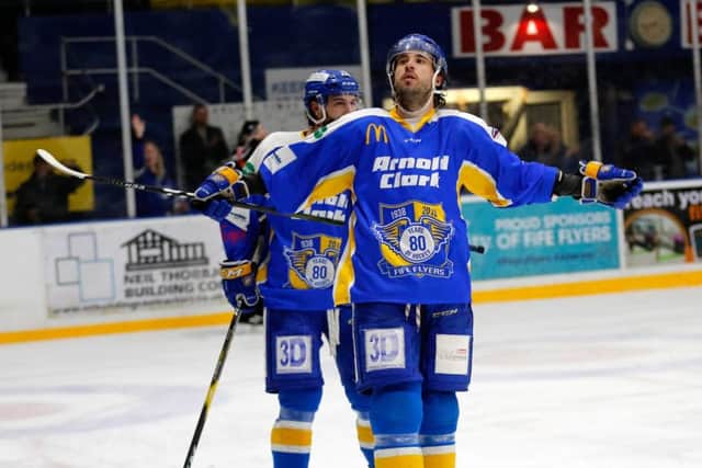 Brett Bulmer takes the acclaim of the crowd after scoring against MK. Pic: Stephen Gunn Photography.