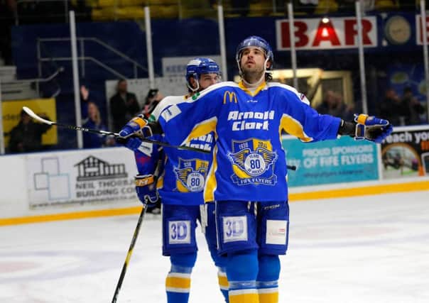 Brett Bulmer takes the acclaim of the crowd after scoring against MK. Pic: Stephen Gunn Photography.