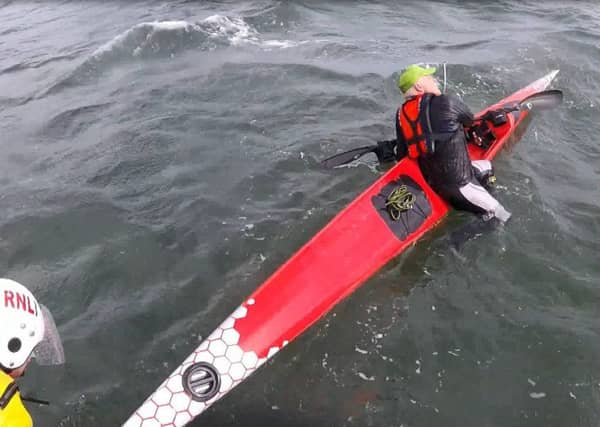 The lifeboat crew reach the kayakers. Pic by Kinghorn lifeboat