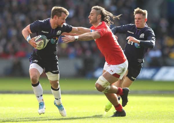 Peter Horne of Scotland is tackled by Josh Navidi of wales during the Guiness 6 Nations match between Scotland and Wales. (Photo by Ian MacNicol/Getty Images)