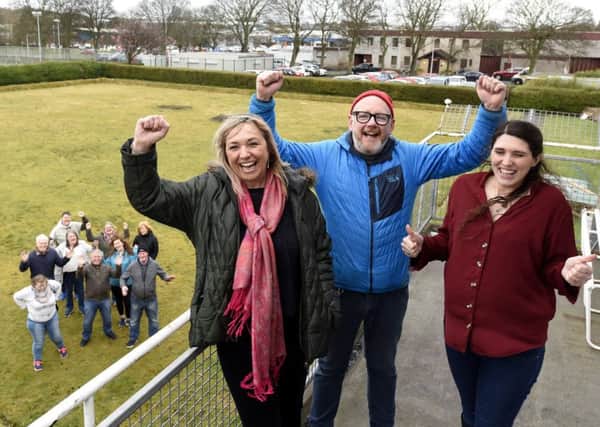 Debbie Kelly, Shuggy Hughes and Joanne Cairns, community development workers celebrate with volunteers at the Gallatown Park site. Fife Photo Agency