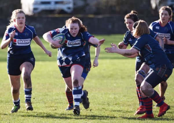 Captain Emma Wood makes a storming run. Pic by Chris Reekie.