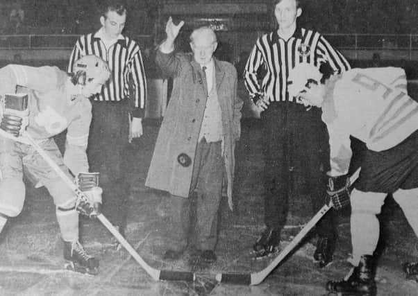Fife Flyers 1973 - John Calderwood, aged 82 - the oldest director of Kirkcaldy Ice Rink - drops the puck at the opening game of the 1973-74 ice hockey season.