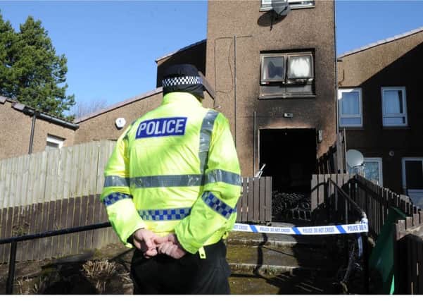 Police remain at the scene of last night's fire in Glenrothes. (Pic George McLuskie).