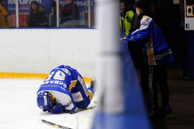 Fife Flyers - Chase Schaber on the ice injured after a hit coach Todd Dutiaume branded "dangerous" and "vicious" in a game against Sheffield Steelers (Pic: Steve Gunn)