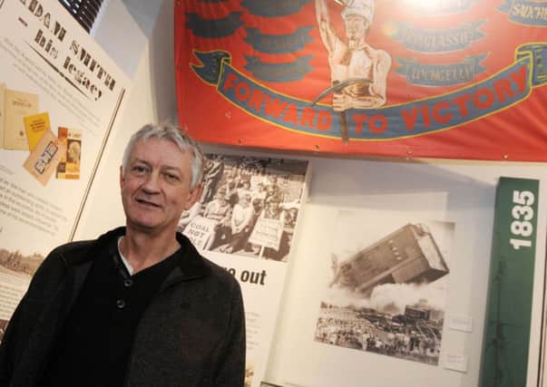 Former Frances colliery miner Tom Adams with the Dysart strike banner. (Pic George McLuskie).