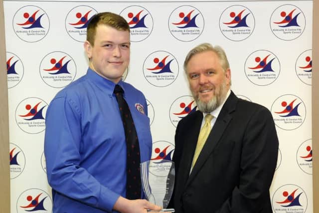 Fife Free Press Sports Personality of the Year winner Connor Wood (Kirkcaldy Rugby) receives his trophy from FFP editor Allan Crow. Runners-up were motor racers Rory Butcher and Jonny Adam, and Fife Flyers coach Todd Dutiaume.