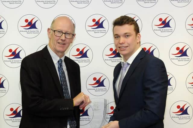 Winner Arran Stowe, of Fins Swimming Club, receives his trophy from Alistair Cameron, representing sponsor MacGregor Solicitors.  Runners-up: Rebecca McGowan (St Johnstone Women FC), Maia McLelland (Dardas Diamond baton twirlers)