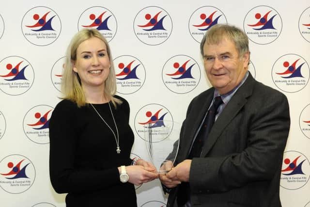 Don Burns (right) collects the award on behalf of Kirkcaldy Rugby head coach Quintan Sanft from Sally Howie of Dundas Estates. Runners-up were martial arts instructor Alex Hunter and Highland dancing teacher Danielle Law.