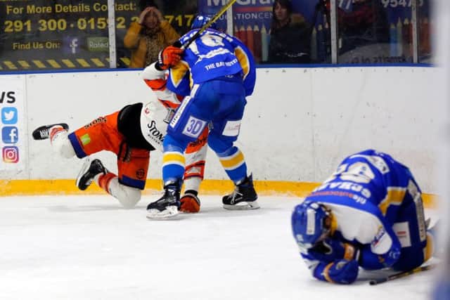 Chase Schaber lies injured on the ice after a hit in the game versus Sheffield Steelers (Pic: Steve Gunn)