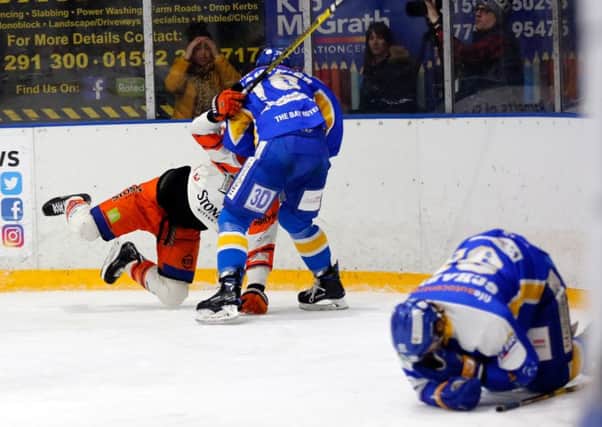 Fife Flyers: Chase Schaber lies injured on the ice after a hit in the game versus Sheffield Steelers (Pic: Steve Gunn)