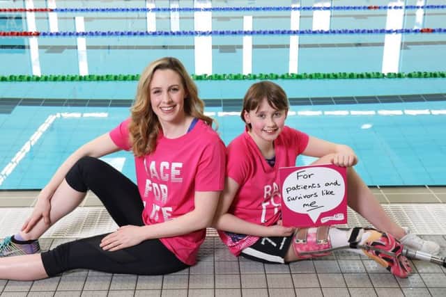 Swimmer Hannah Miley and Katie Pake, who lost part of her leg through cancer, pictured at Aberdeen Aquatic Centre, for Cancer Research UK.

Picture Simon Price