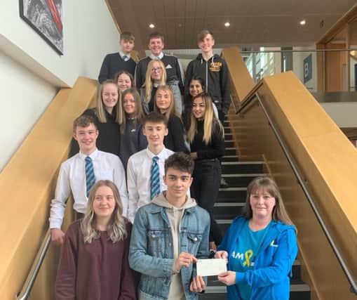 Auchmuty High School pupils presented Team Jak with a cheque for £250.