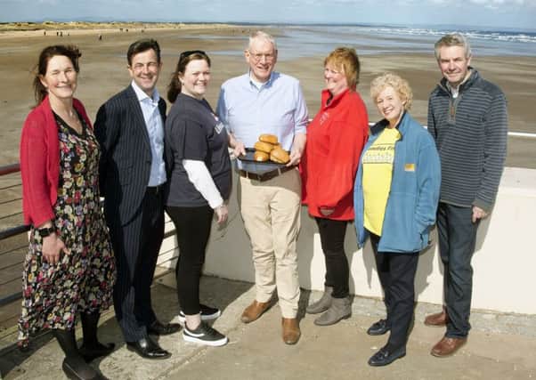 Sponsors and supporters of this years event pictured against the backdrop of West Sands Beach.