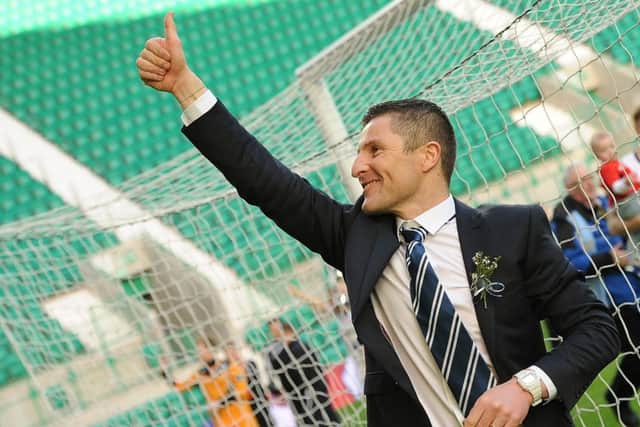 Raith manager Grant Murray salutes the fans