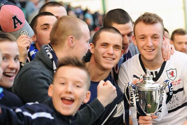 Greig Spence with Rovers fans after winning the cup