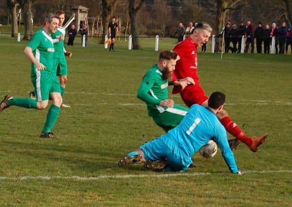 Lewis Payne, in red, wrapped up the win for Tayport. Stock image.