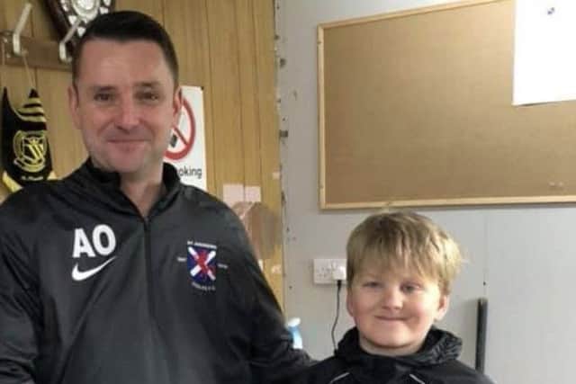 Euan is pictured with his team manager Andy ONeill.