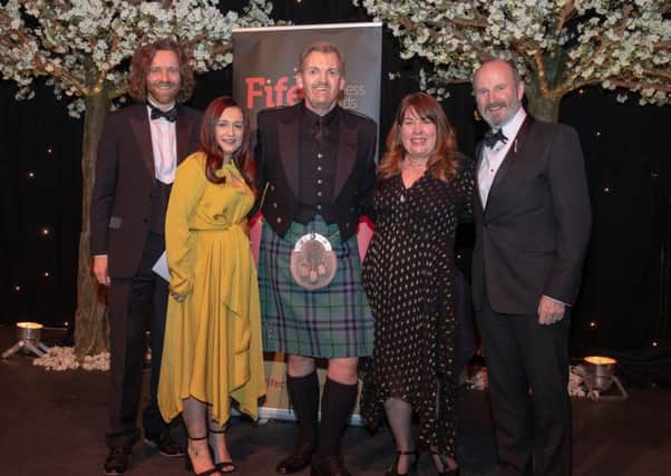 David Smith, Managing Partner of category sponsor Henderson Loggie, and host Fred MacAulay with the Byron team - Ronnie Marshall, Megan Paterson and Jill Graham. Pic: Kenny Smith.