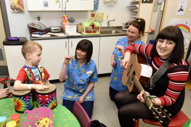 From left: Young patient Bradley Gow, health play workers Corina Mutch, Pam Shannon and musician Amy Rayner. Pic: Fife Photo Agency.