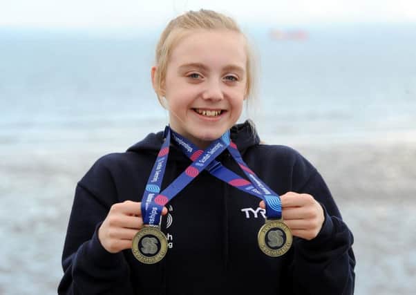 Erin Taylor shows off her two gold medals (Pic by Fife Photo Agency)