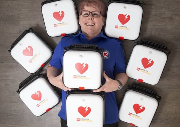 New defibrillators for St Andrews First Aid - pictured is Jacine Clark, Queen St Company, volunteer first aider