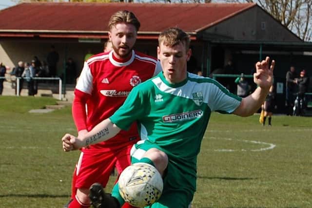 Carnoustie Panmure midfielder Jamie McCabe and Thornton Hibs midfielder Darrell Anthony
