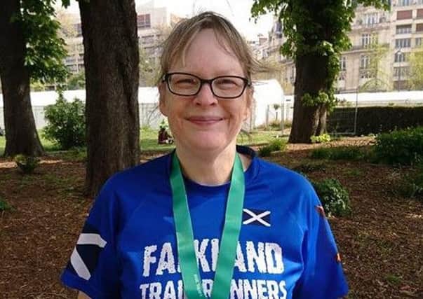 Falkland Trail Runners Fiona Malone with her medal following her run in the Paris Marathon in which 55,000 runners took part.