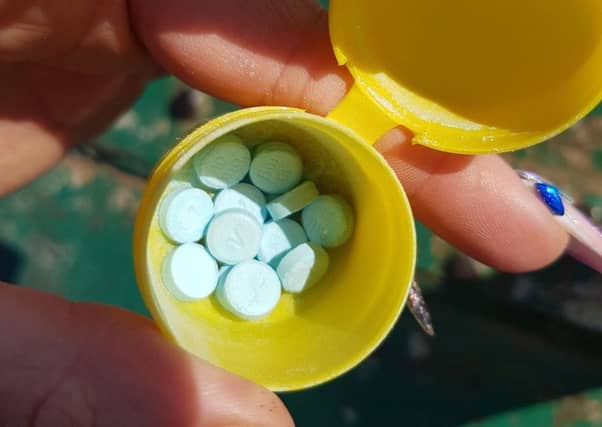 The plastic container with the drugs inside
