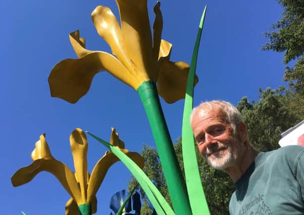 Malcolm Robertson with one of his most famous creations -  Giant Irises.