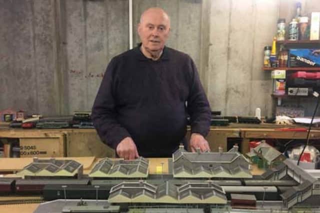 Barry Poll with his model railway set, which he keeps in his garage.