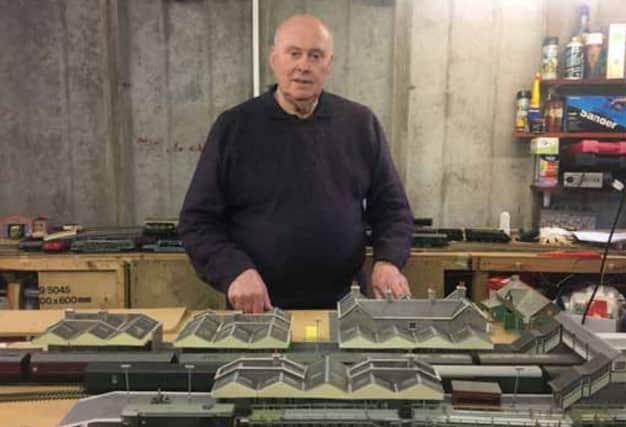 Barry Poll with his model railway set, which he keeps in his garage.