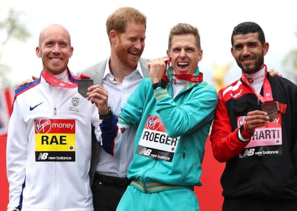 Derek Rae is congratulated by Prince Harry after winning silver (Photo by Naomi Baker/Getty Images)