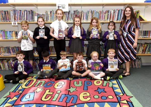 Teacher Sarah Donaldson with pupils and the new books. Pic: Fife Photo Agency.
