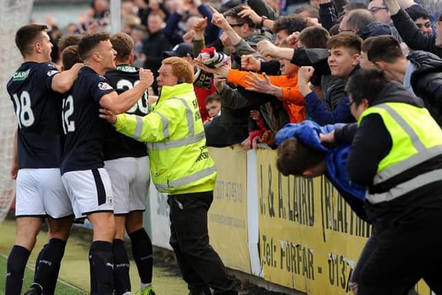 Raith players celebrate Kevin Nisbet's penalty kick with the travelling fans. Pic: Fife Photo Agency