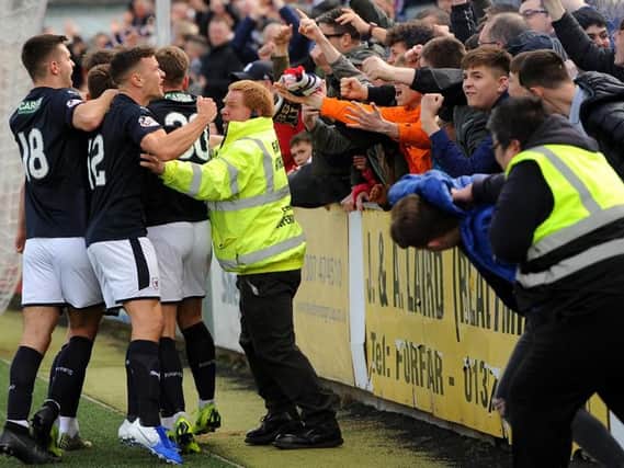 Raith players celebrate Kevin Nisbet's penalty kick with the travelling fans. Pic: Fife Photo Agency