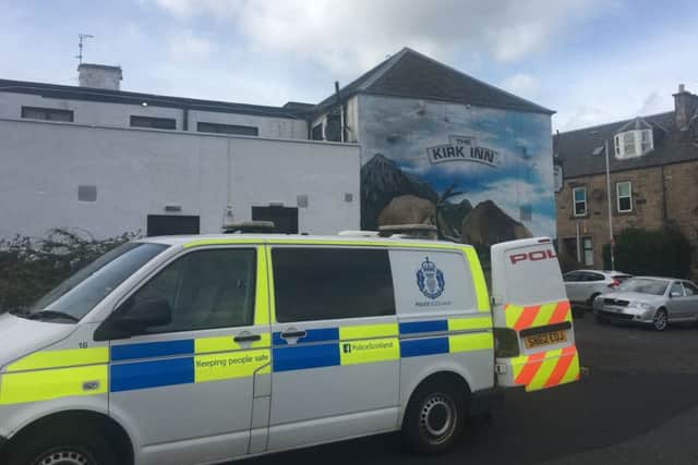 Police raiding the Kirk Inn (Pic: Fife Free Press)