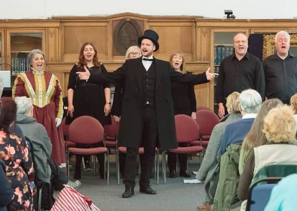 Andrew Carnegie's great-great-great grandson Joe Whiteman (centre) and Ian Hammond Brown (second right), writer of Carnegie the Star Spangled Scotchman, join some of the cast in performing songs from the show at the launch at the Dunfermline Carnegie Library & Galleries. Pic: ASM Media & PR.