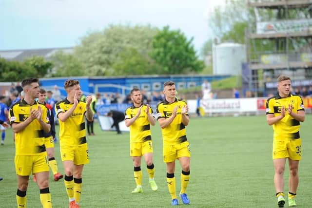 Dejected Raith players applaud the travelling fans at full-time. Pic: Fife Photo Agency