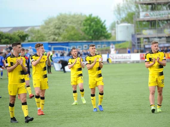 Dejected Raith players applaud the travelling fans at full-time. Pic: Fife Photo Agency