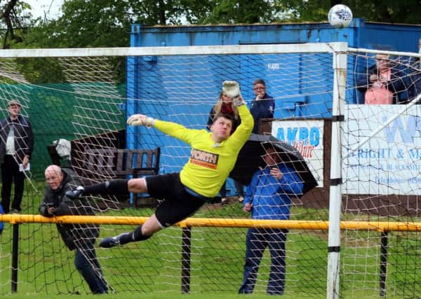 Robbie Paterson saving a Pumpherston free kick.
