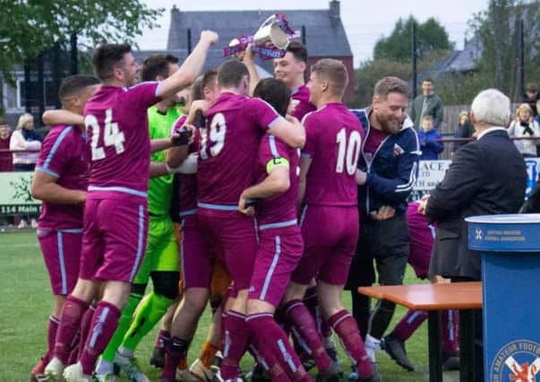 Cupar Hearts celebrate their cup win.