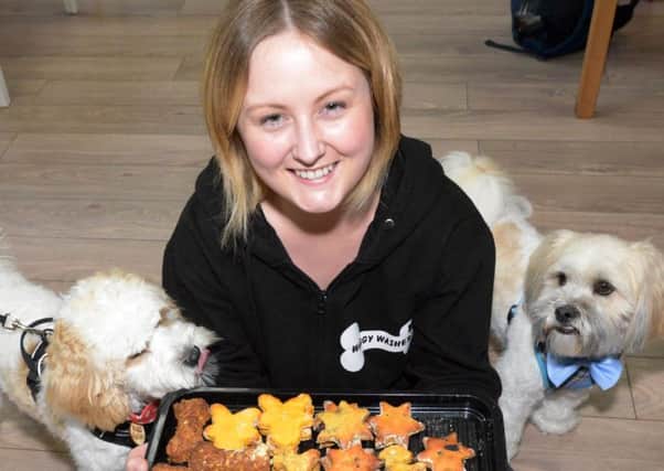 Jenna McMurran with Clive, who gave the paws up to the goodies. Pics by George McLuskie