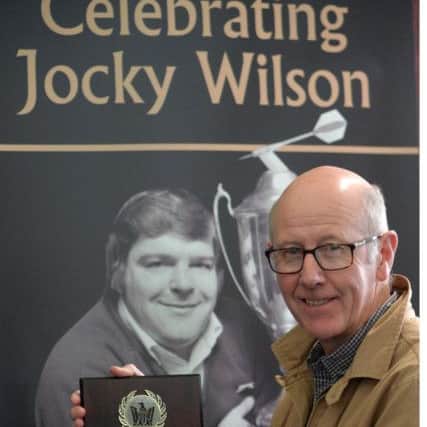 Cllr Alistair Cameron  with Jocky's Hall of Fame plaque (Pic: George McLuskie)